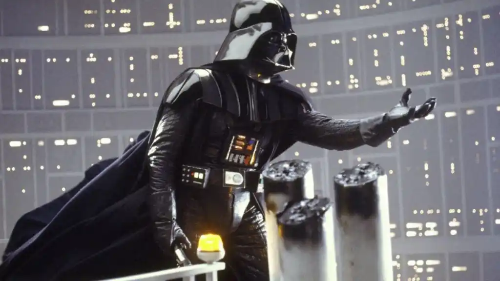 Image of Darth Vader surrounded by melted pillars reaching forward with his left hand, beseeching someone off screen