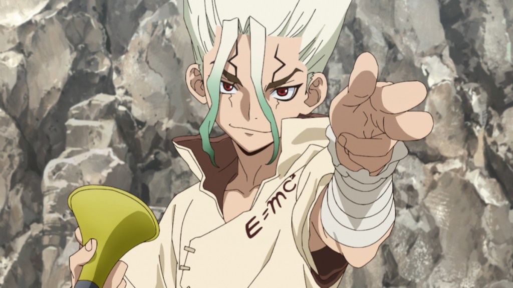 Senju pointing at the camera in Dr Stone with a rock wall behind him and a smug look on his face