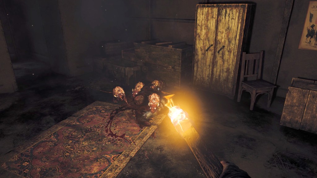 Amnesia: The Bunker, the player holding a lit stick in front of a group of rats in a bunker as part of an article about the best horror games