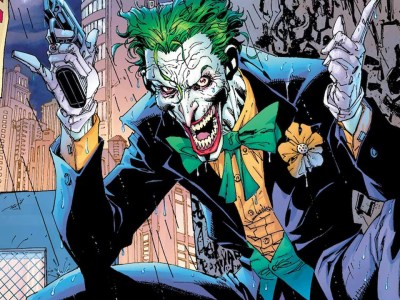 Batman villain The Joker, holding a fake gun.