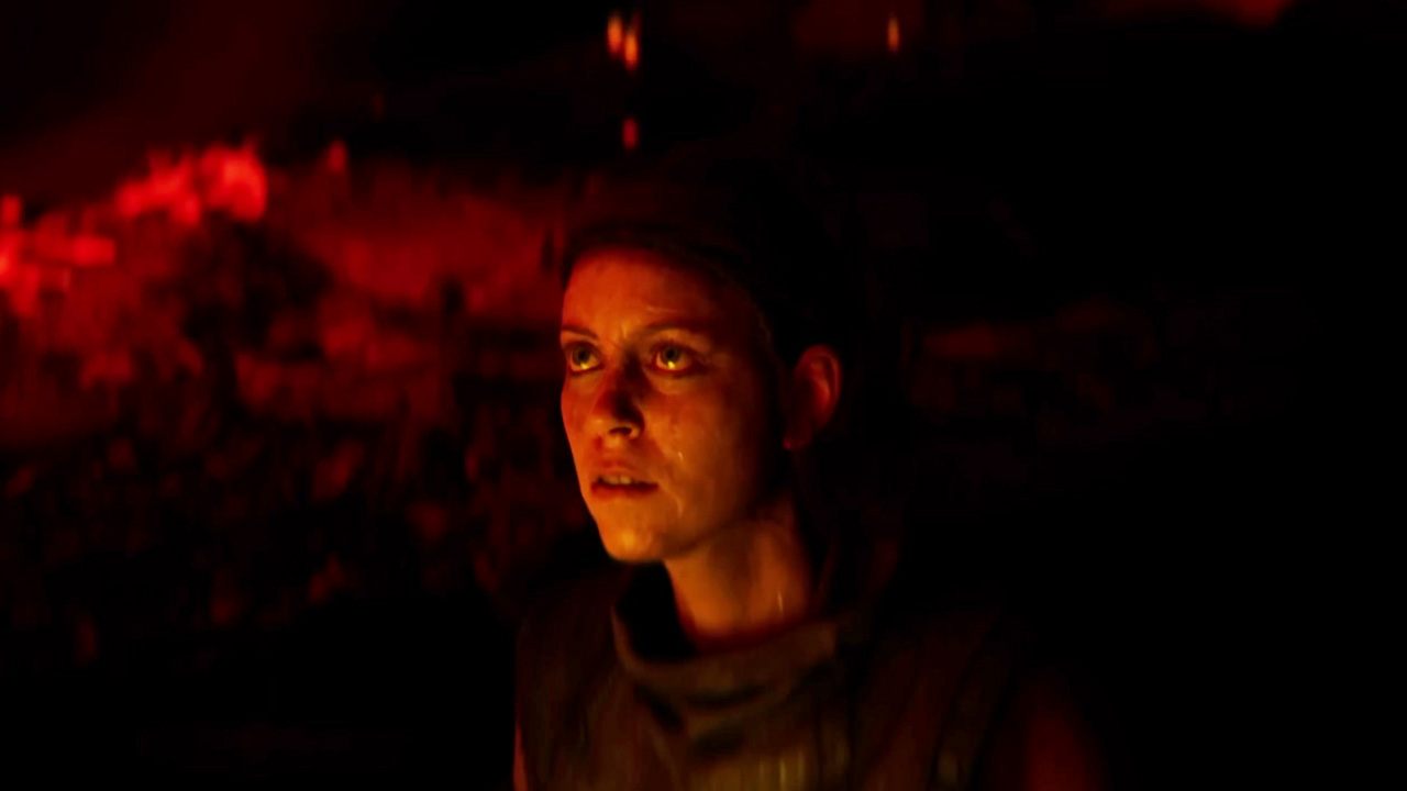 Hellblade 2, Senua against a red, volcanic-looking background.