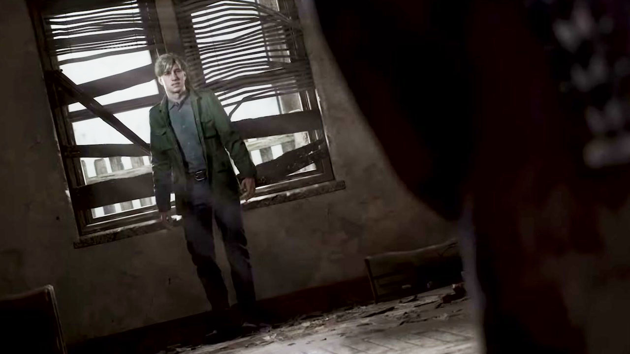 Silent Hill 2, protagonist James Sunderland backing up against a window in a darkened room.
