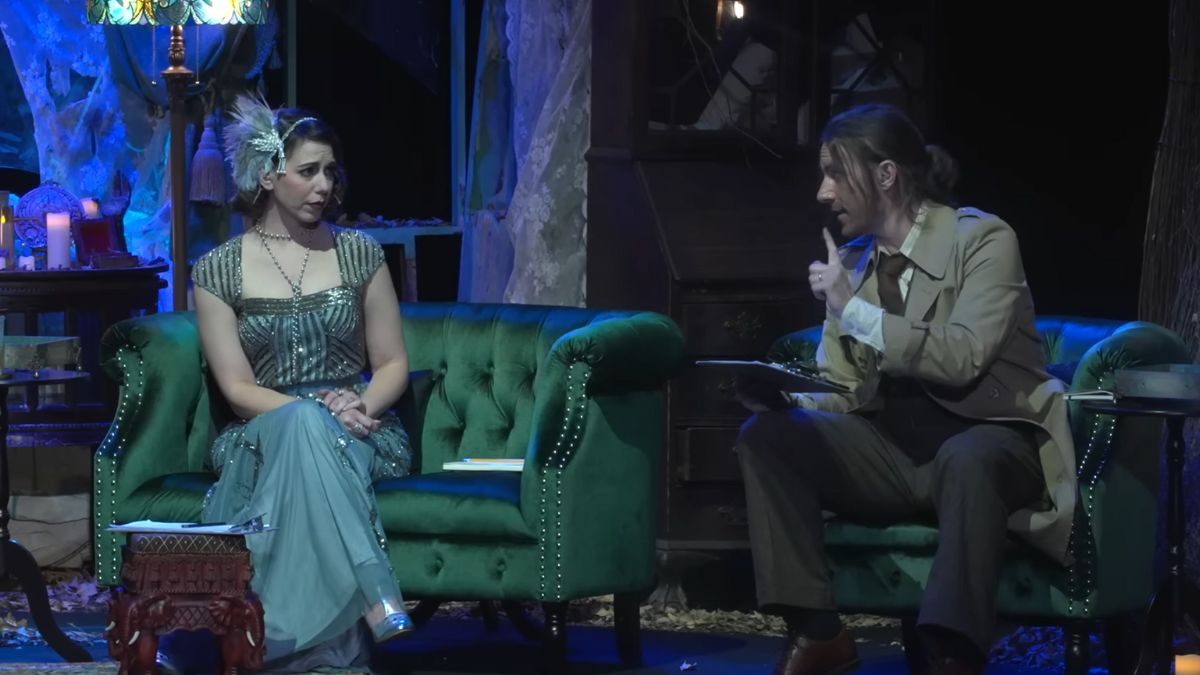 A man talking to a woman in Candela Obscura.