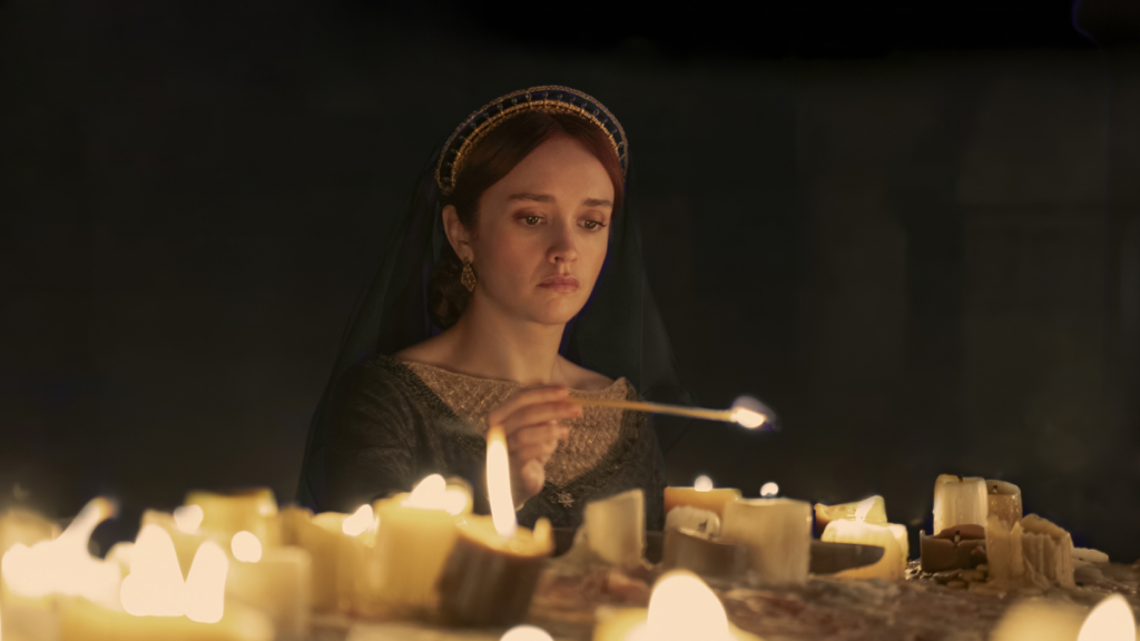 Dowager Queen Alicent Hightower lighting candles in House of the Dragon Season 2
