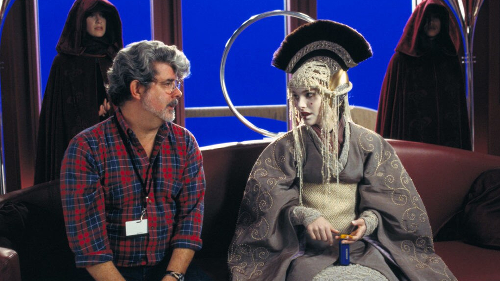 George Lucas and Natalie Portman in a Star Wars: The Phantom Menace behind-the-scenes still