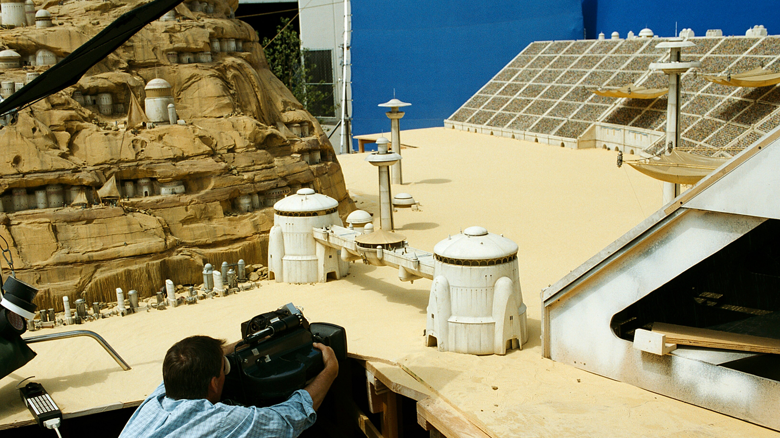 A behind the scenes still from Star Wars: The Phantom Menace showing the pod race arena miniature