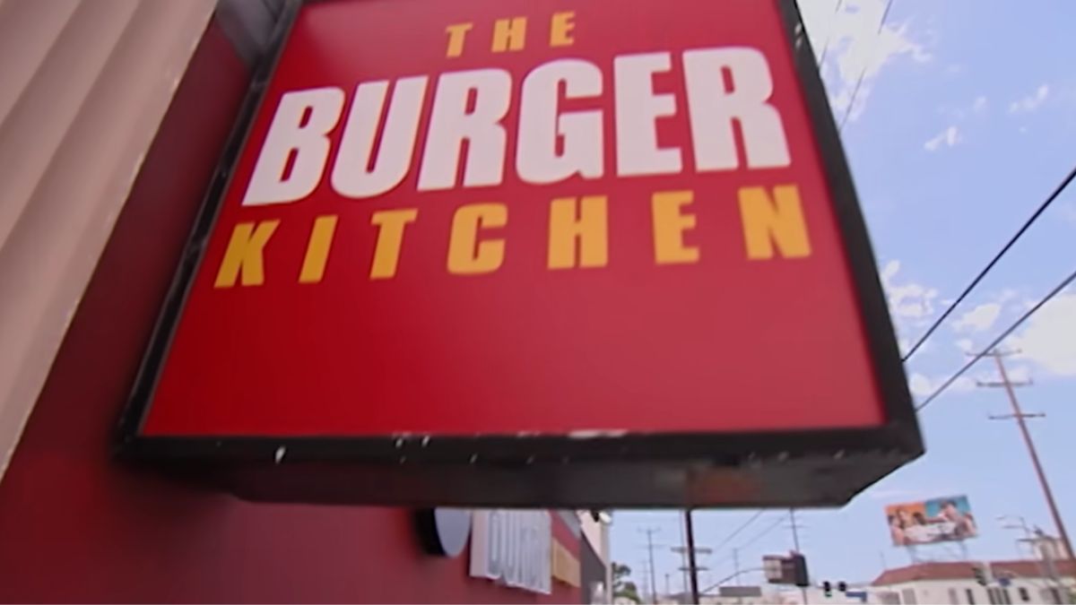 Screenshot showing Burger Kitchen sign from the show 