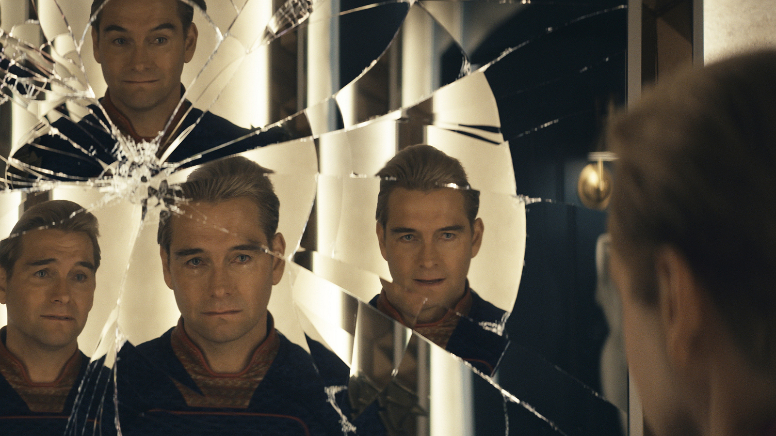 Homelander staring at a cracked mirror with multiple reflections in The Boys Season 4