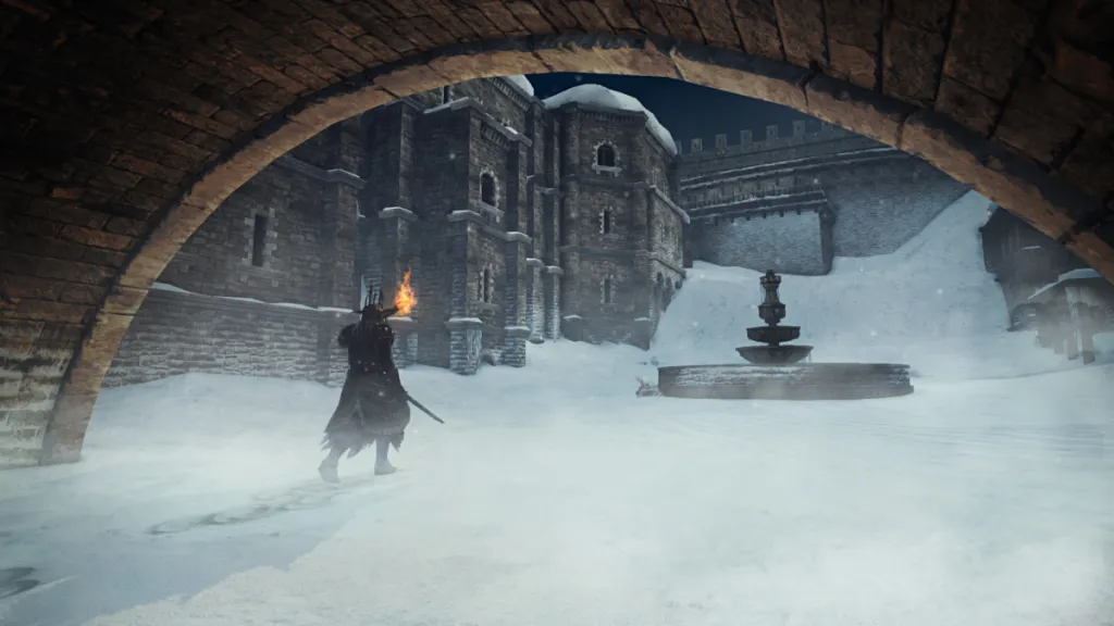 the player walking in snow beneath a bridge