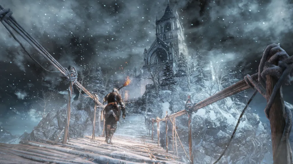 the player walking across a snowy bridge to a tower