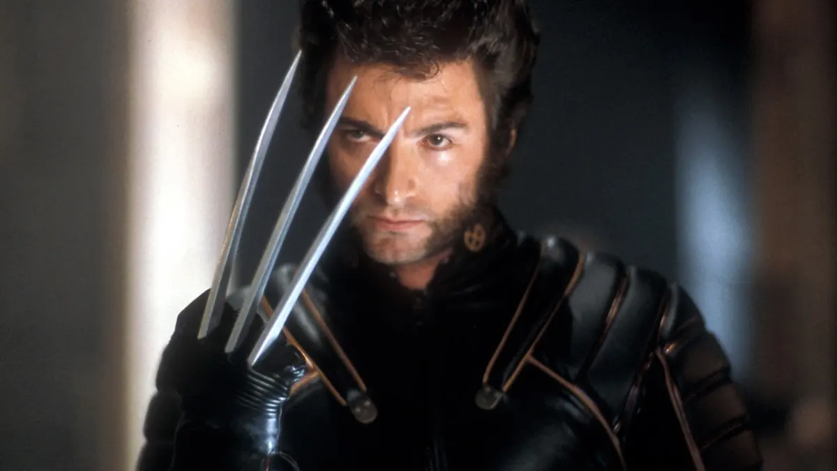 Wolverine with his claws out in X-Men. This image is part of an article about every Wolverine movie ranked from worst to best.