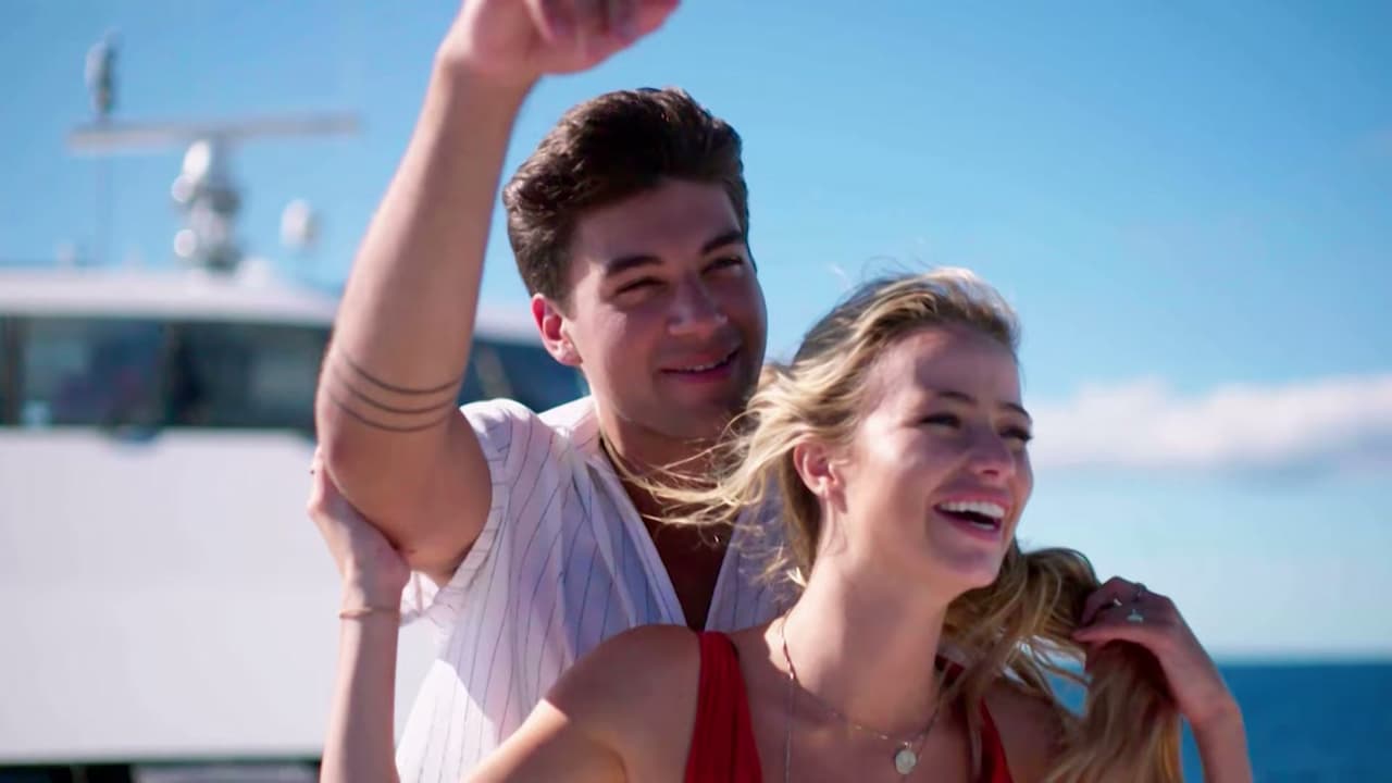 Zac and Elizabeth on Love Island, standing on the deck of a boat.