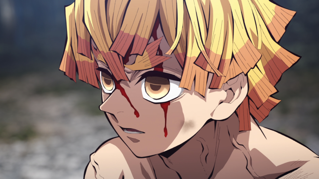 A bloodied Zenitsu looks forward in Demon Slayer