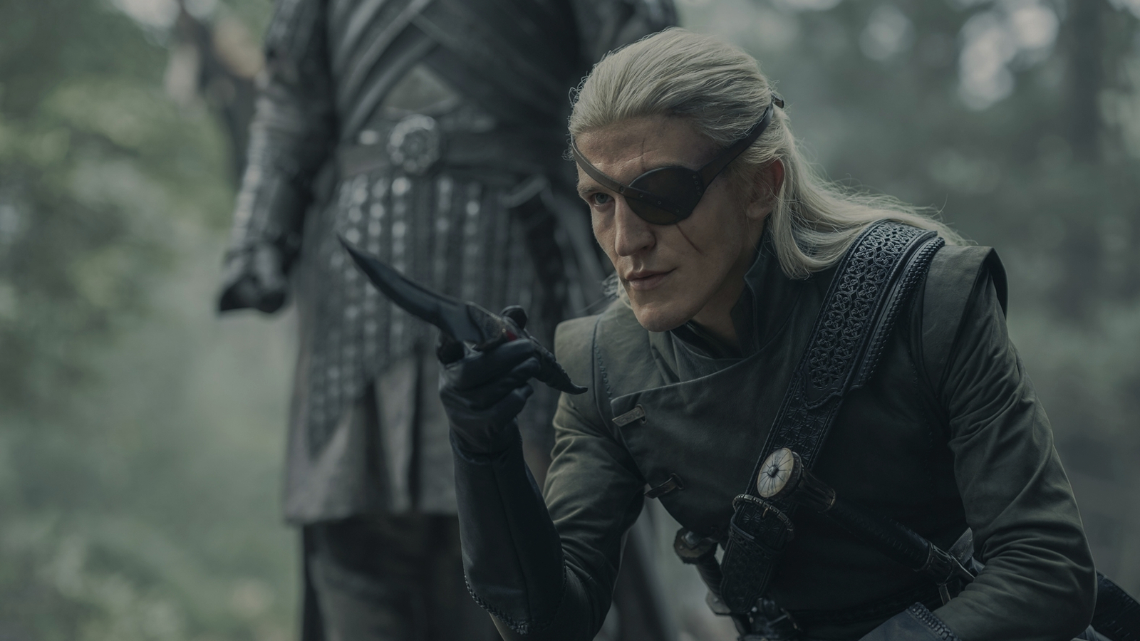Prince Aemond Targaryen points with a Valyrian steel dagger in House of the Dragon Season 2, Episode 4