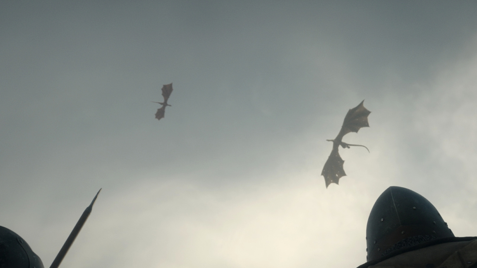 Two soldiers watching dragons fighting in the sky in House of the Dragon Season 2, Episode 4