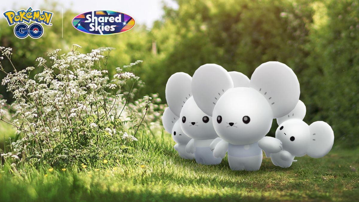 An image of Tandemaus standing together on a patch of grass with white flowers beside them in Pokemon GO