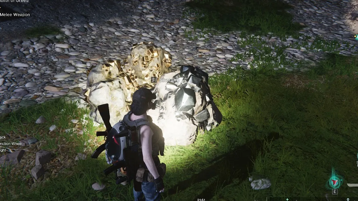 Player looks down at a silver ore node outside in the dark in Once Human