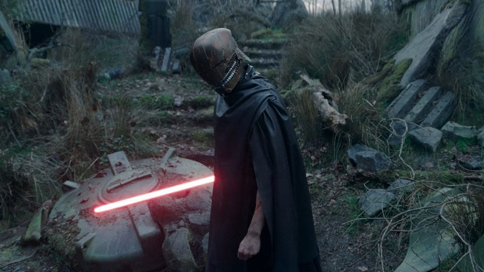 Qimir/The Stranger with his red lightsaber in The Acolyte Season 1, Episode 8