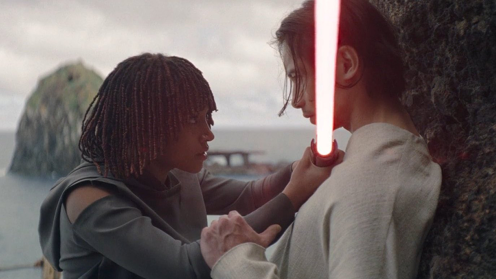 Osha holds a lightsaber to Qimir/The Stranger's neck in The Acolyte Season 1, Episode 6