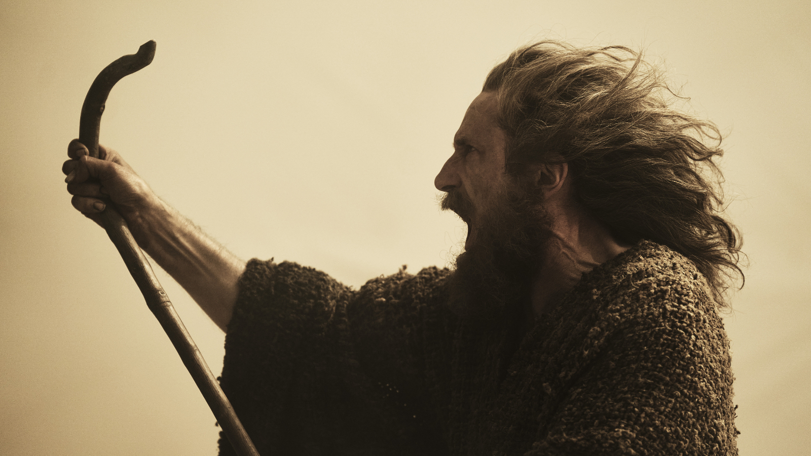 The Stranger brandishing his staff in The Lord of the Rings: The Rings of Power Season 2