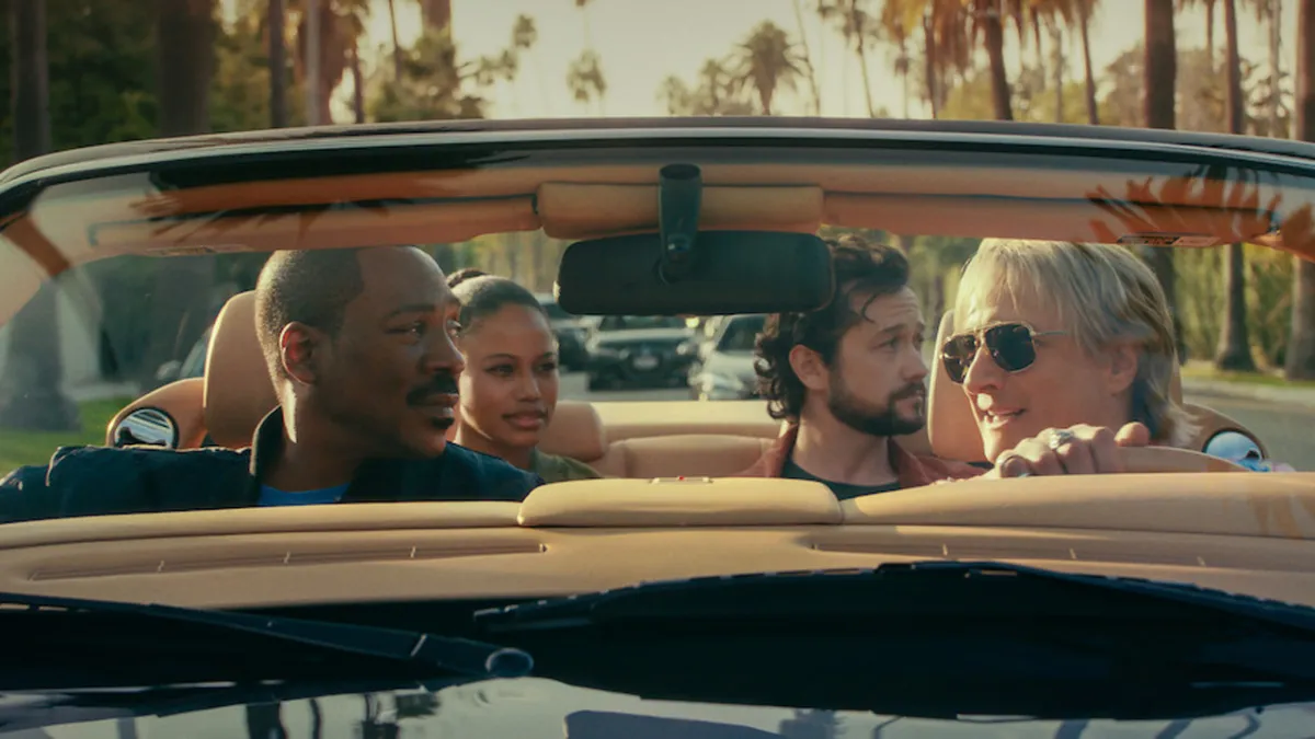 Axel Foley and friends in a convertible in Beverley Hills Cop: Axel F, as part of an article on all the cast and actors in the project.