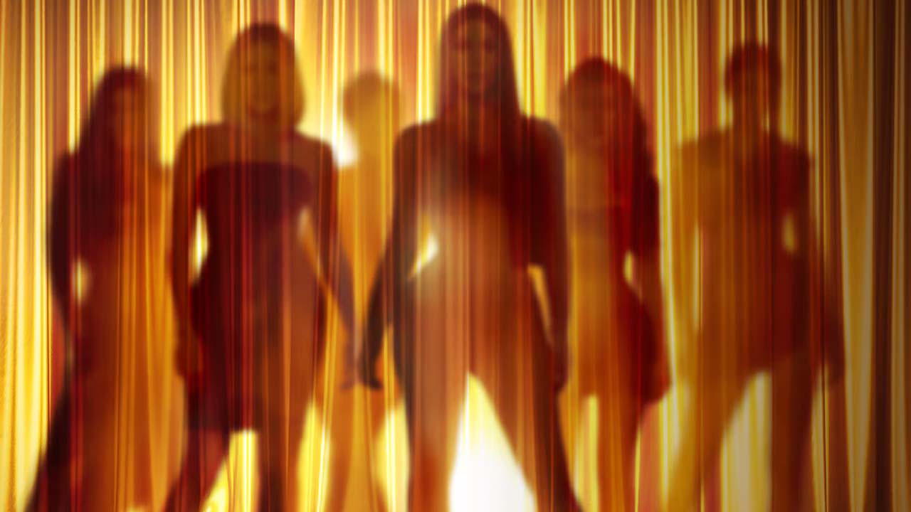 Keeping Up With the Kardashians, the family shown standing behind a curtain.