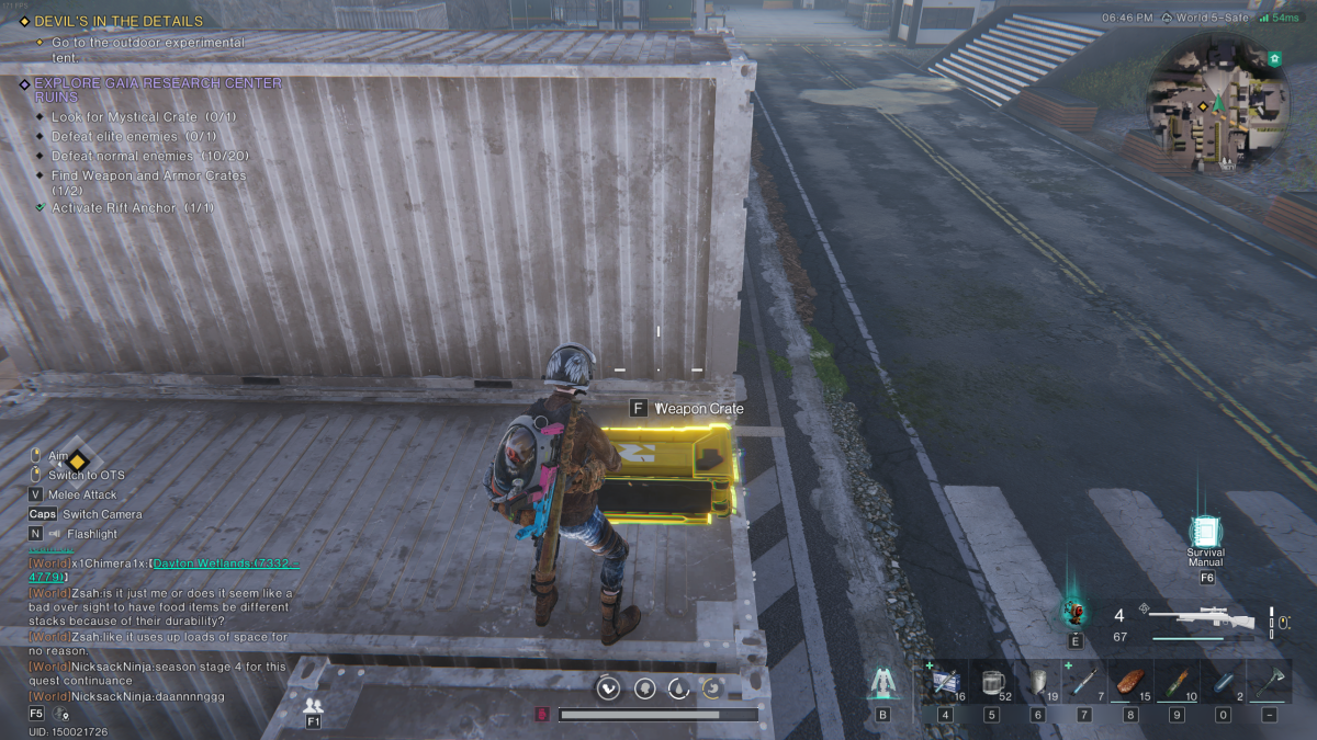 The player stands on a dingy cargo crate with a weapon crate at their feet