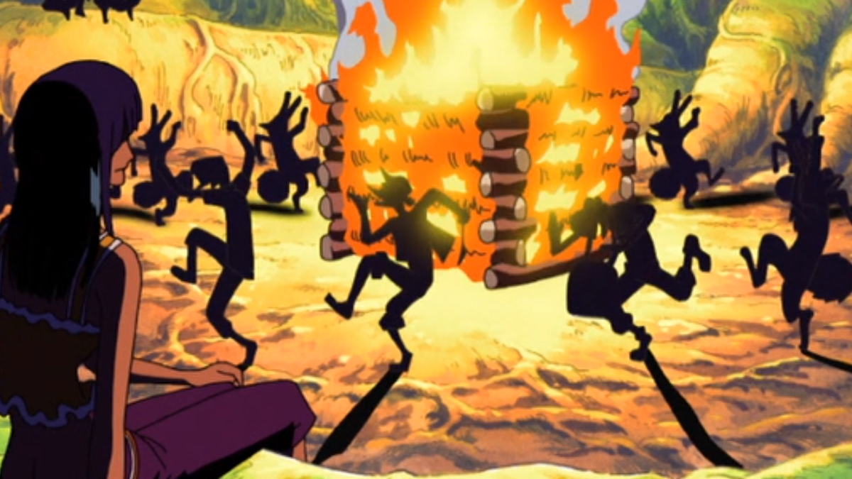 Image of several characters dancing around a large bonfire, their shadows cast on the ground