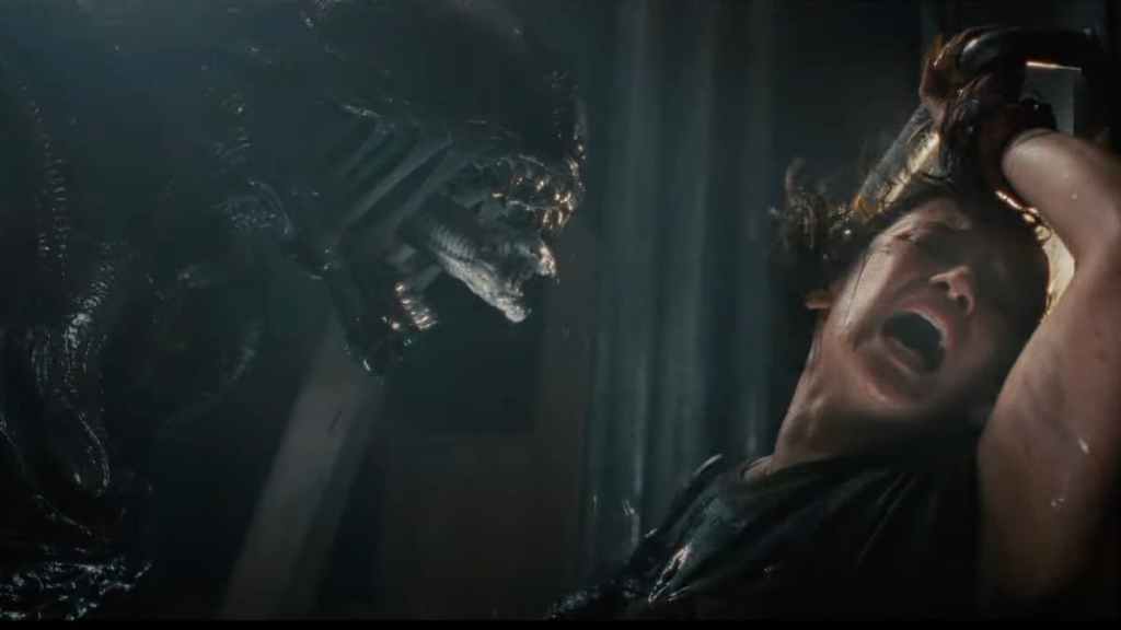 A Xenomorph terrifying the character Rain in Alien: Romulus