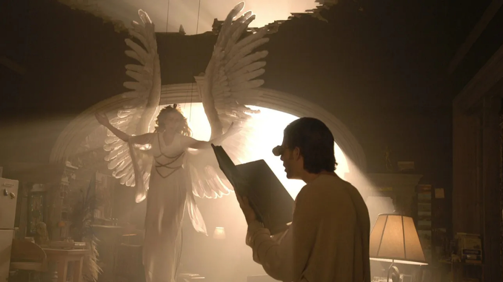 A scene from HBO's Angels in America miniseries, with an angel hangign from a roof and a man reading a book