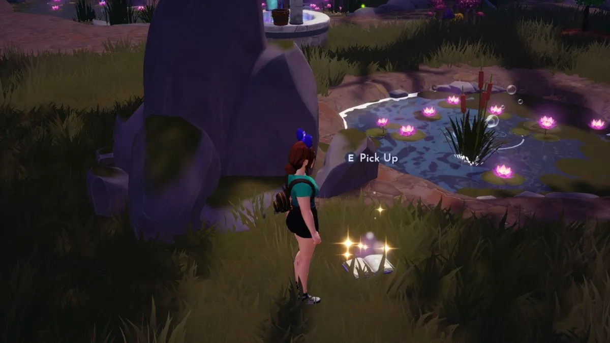 Screenshot of a character in Disney Dreamlight Valley looking at a cookbook on the ground in the Glade of Trust