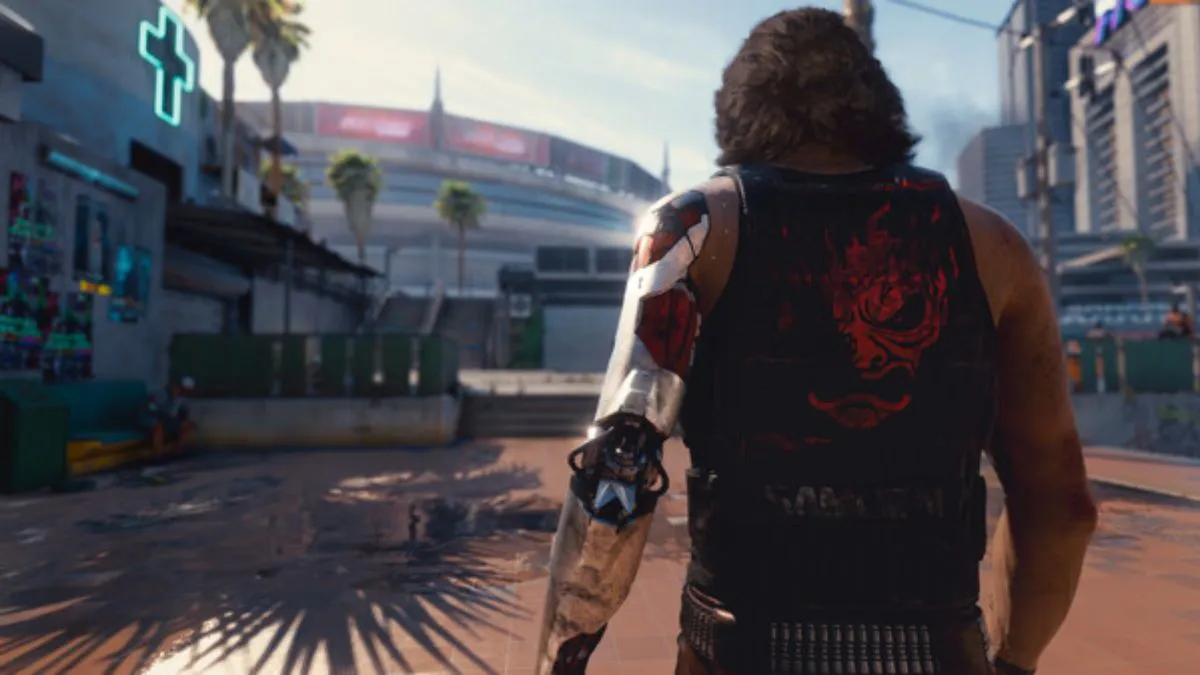 Screenshot from Cyberpunk 2077 showing a man with a cybernetic arm slowly walking towards a hospital