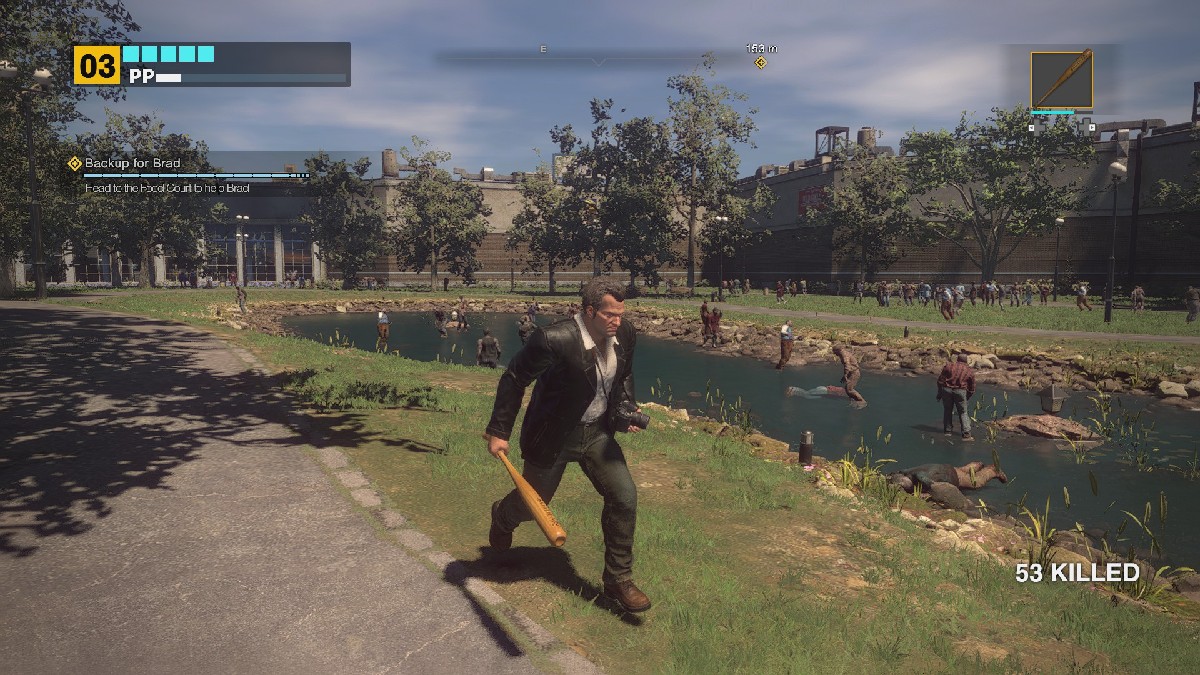 An image of Frank West running outdoors in Dead Rising Deluxe Remaster with a gaggle of zombies surrounding him