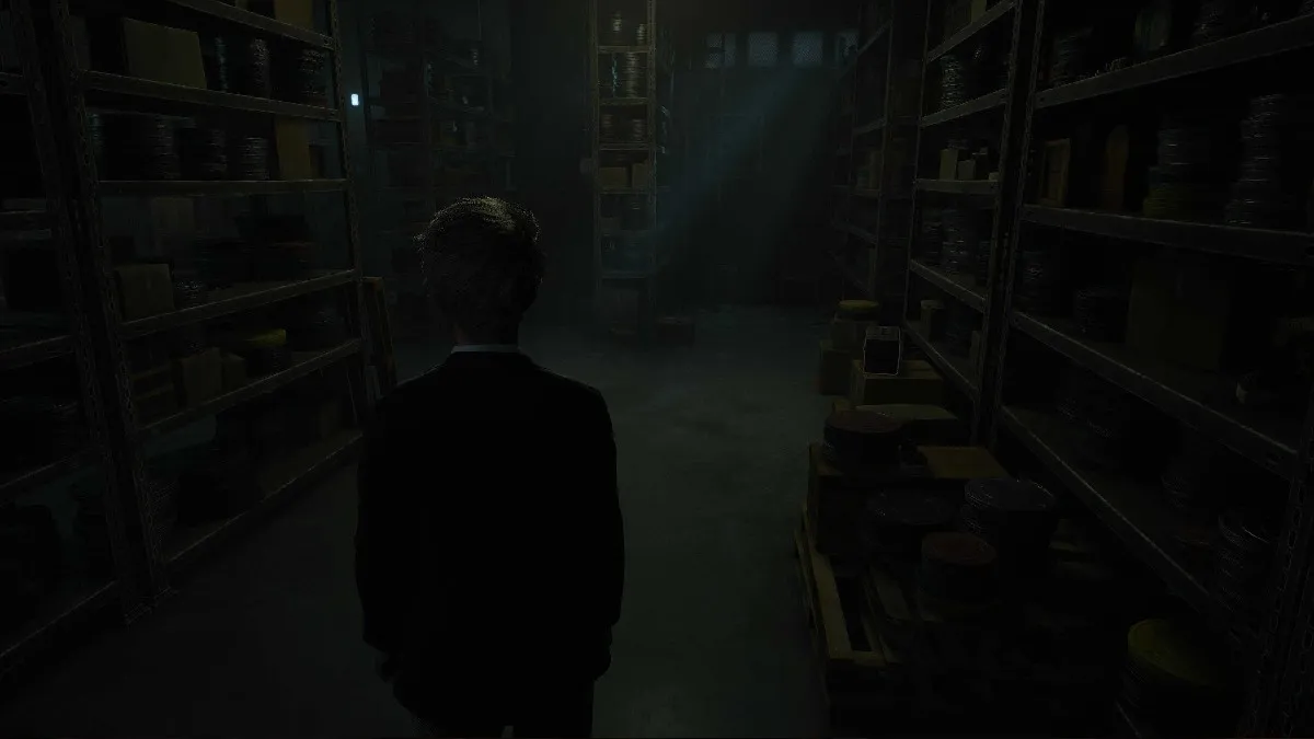 The player character stands in a dark room in The Casting of Frank Stone, which is full of shelves stocked with an assortment of random items