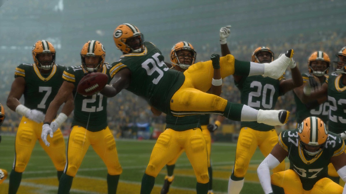 A photo of the Green Bay Packers celebrating a recovered fumble in an article detailing the best sliders for realistic gameplay in Madden NFL 25