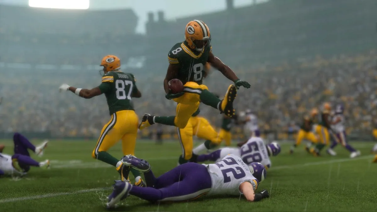 An image of a Green Bay Packer hurdling over a member of the Minnesota Vikings in Madden NFL 25 in a review of the game.