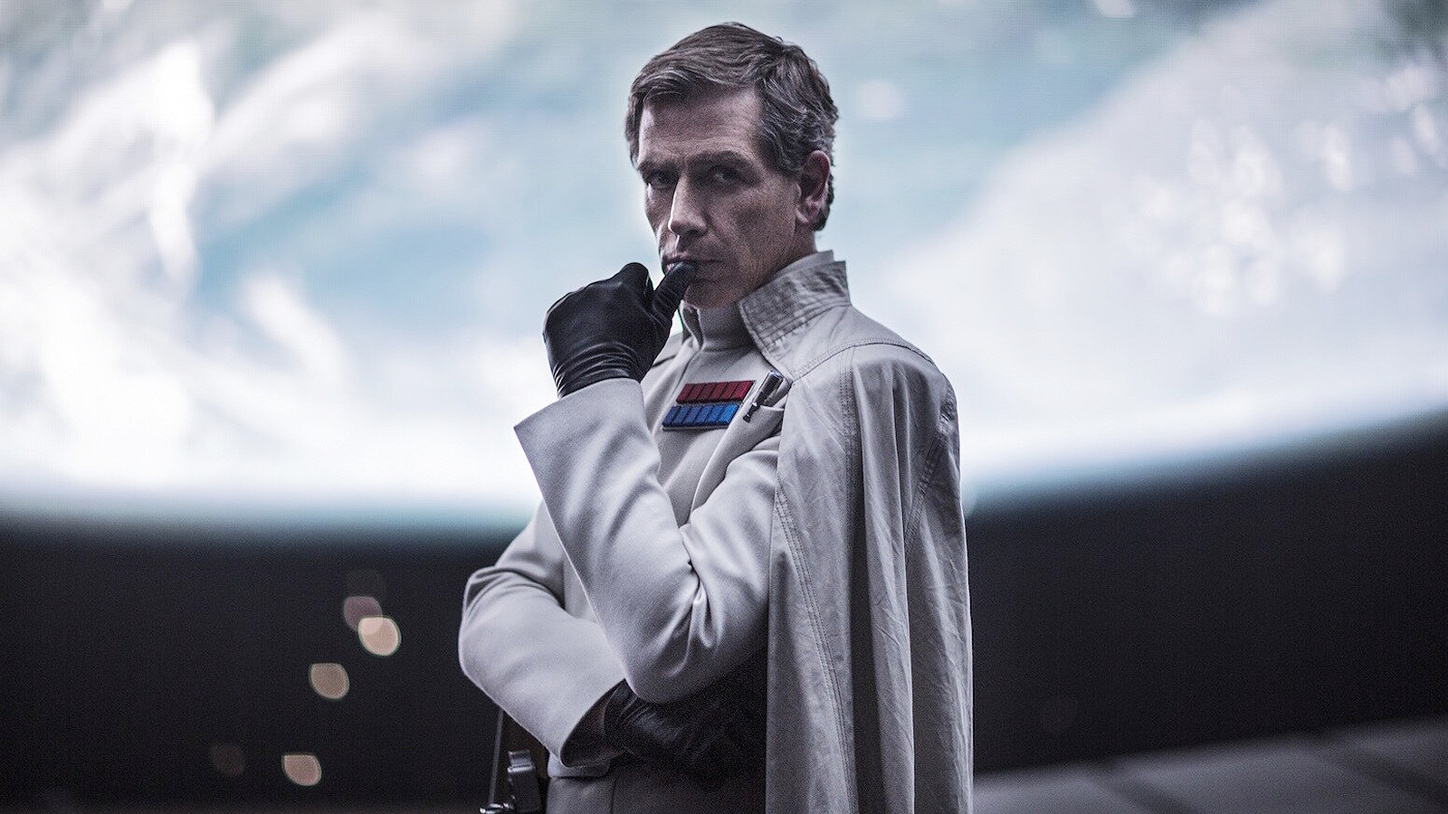 Orson Krennic with his hand on his chin in Rogue One: A Star Wars Story