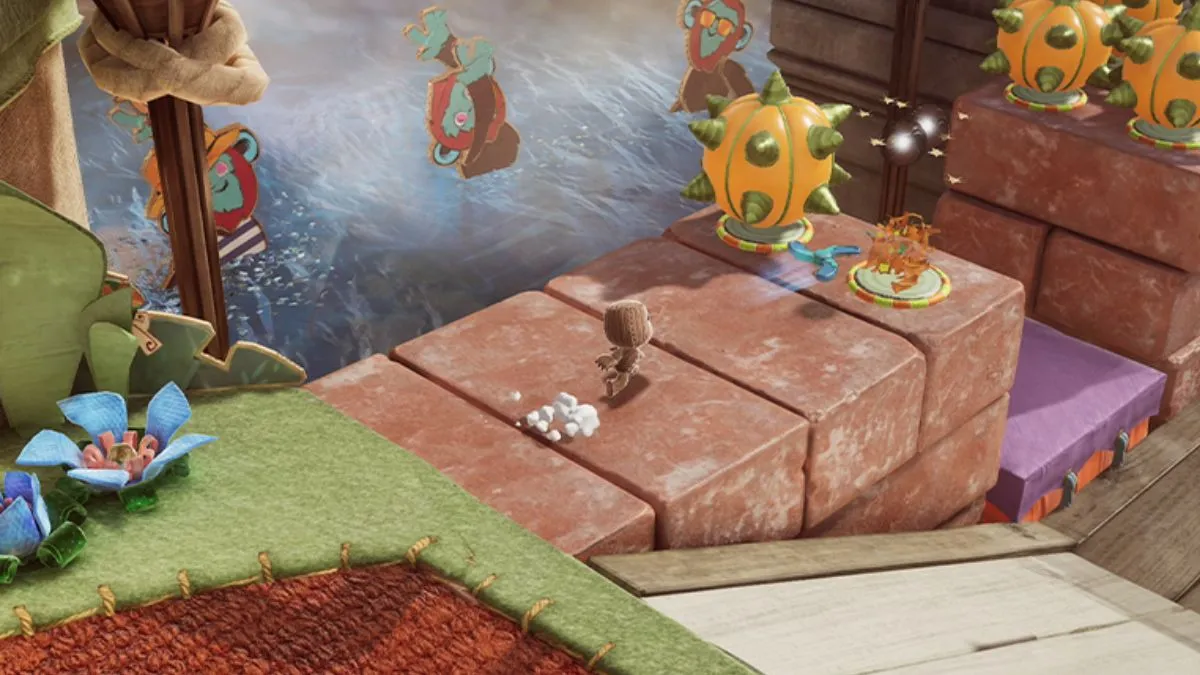 Screenshot showing gameplay in Sackboy a Big Adventure, with the main character taking on combat