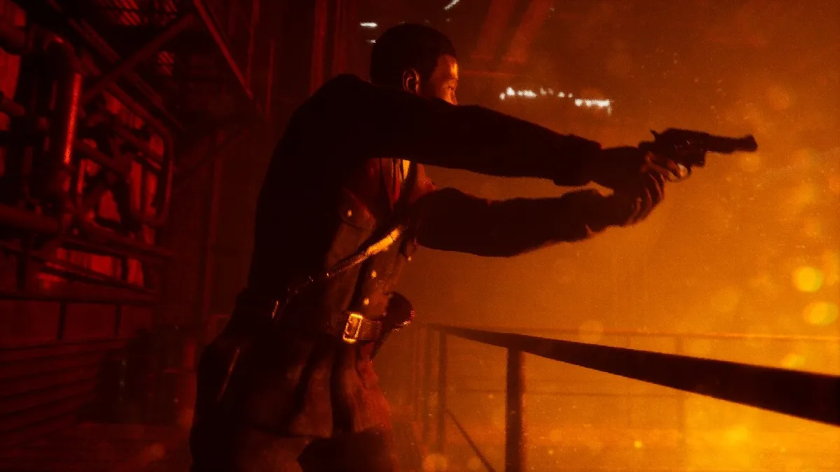 Sam Green in The Casting Of Frank Stone points his gun over a metal railing towards something that looks like it might be on fire