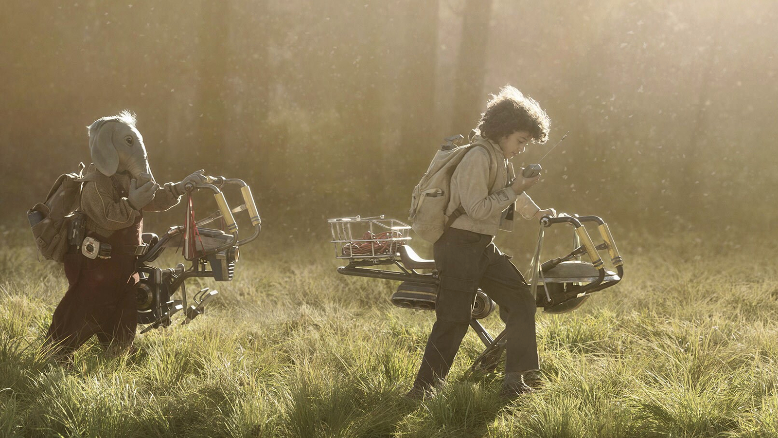 Neel and Wim walking their speeders through the forest in Star Wars: Skeleton Crew