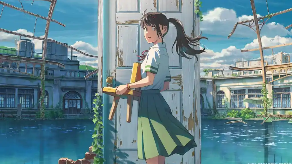 A girl stands outside of a white door that's not connected to a building in some ruins in anime movie Suzume