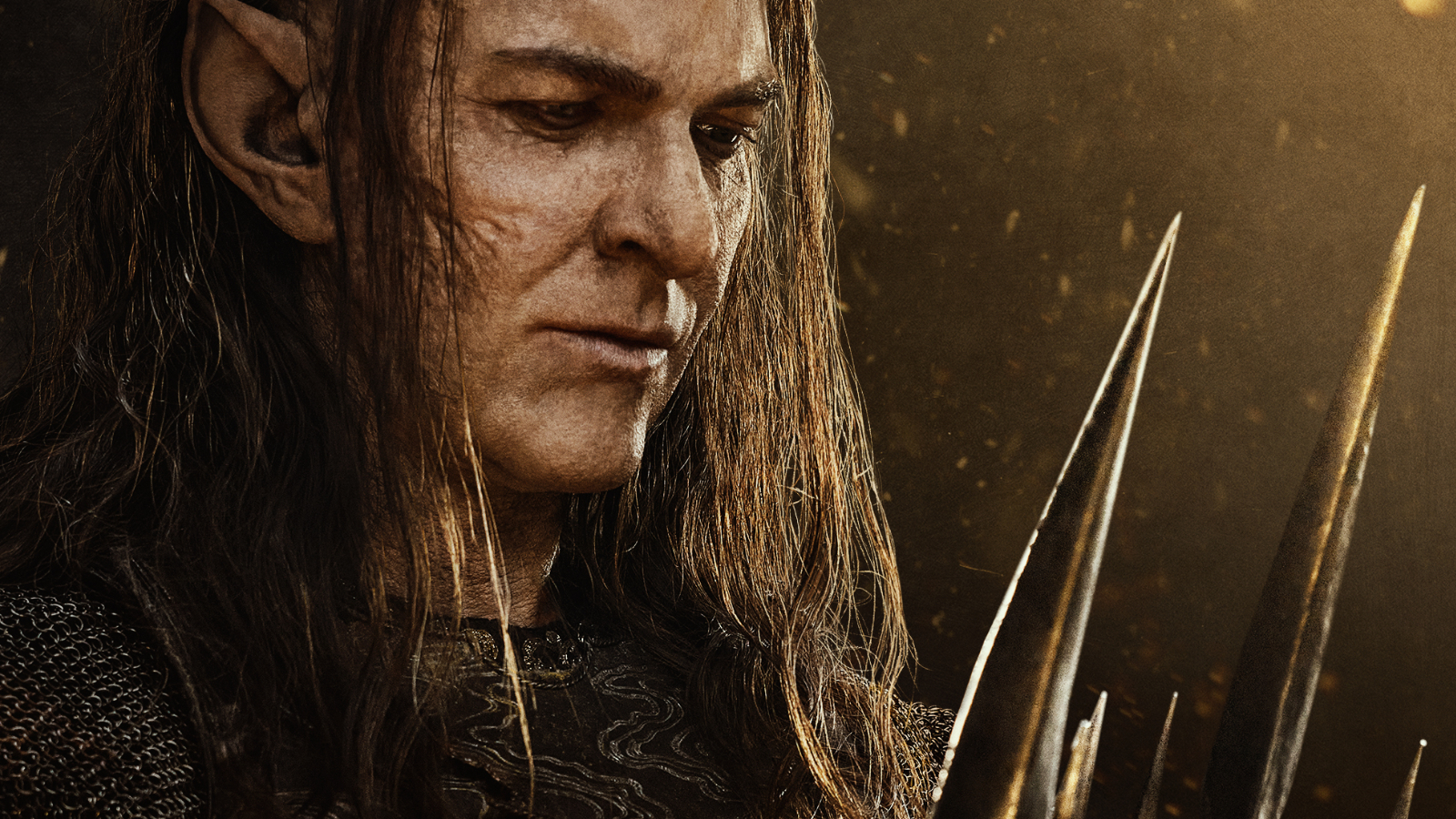 Cropped The Lord of the Rings: The Rings of Power Season 2 key art of Adar holding a crown