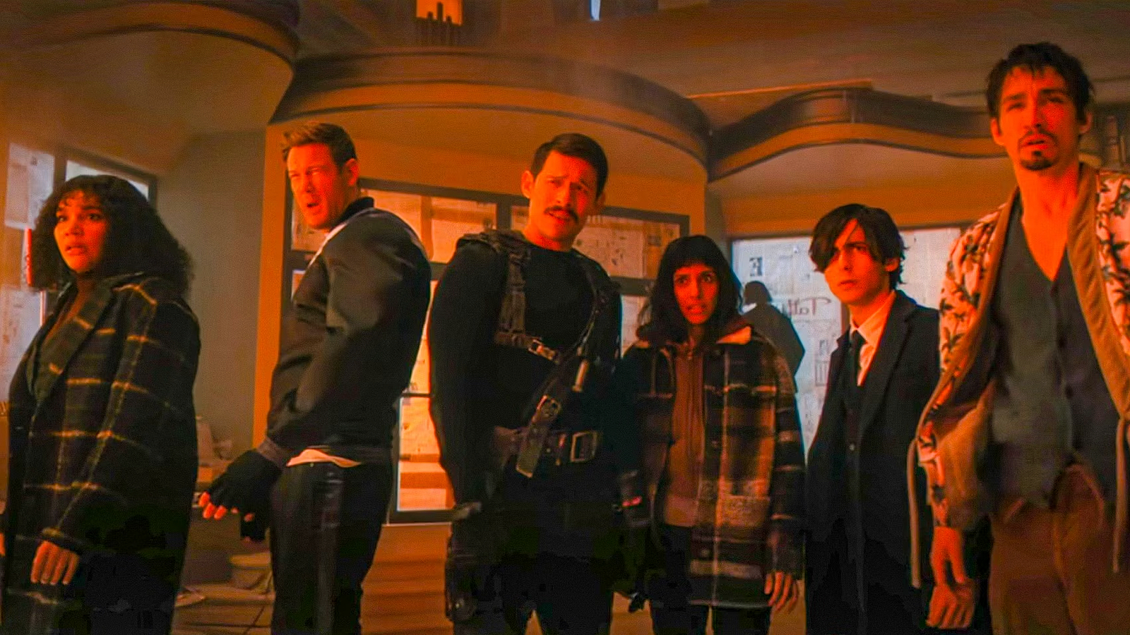 The Hargreeves family and Lila bathed in red light in The Umbrella Academy Season 4, Episode 6