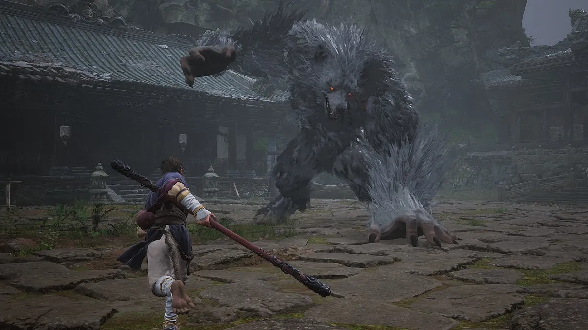 Wukong fights the wold boss in Black Myth: Wukong.