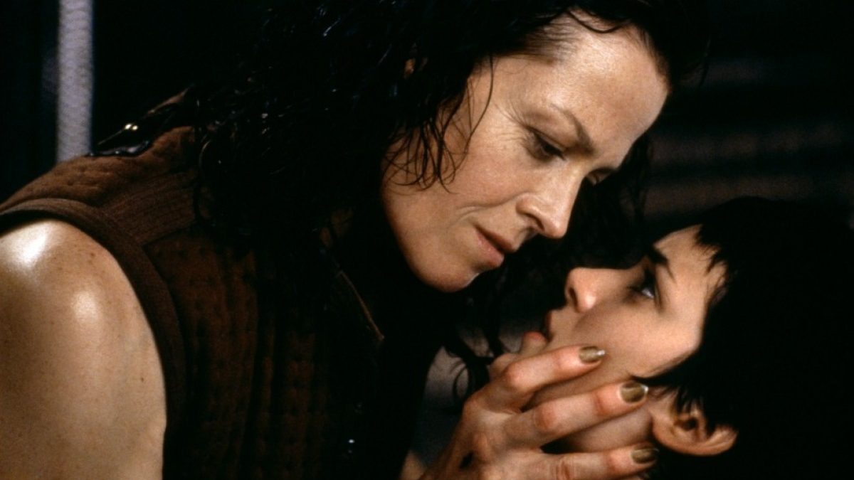 Ripley holding a girl's face in Alien: Ressurection. 