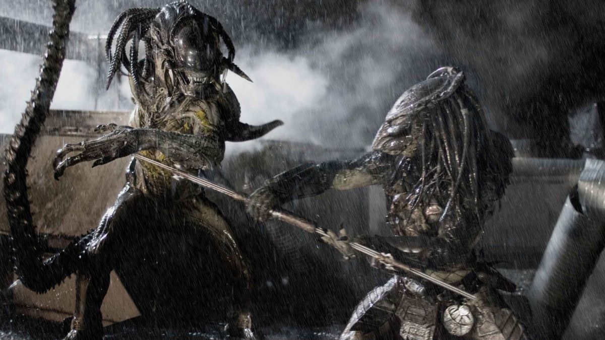 Alien and Predator fighting in Alien vs. Predator.