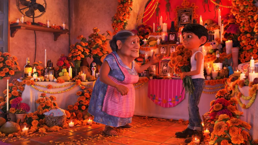 Miguel speaks with his grandmother by their ofrenda in coco