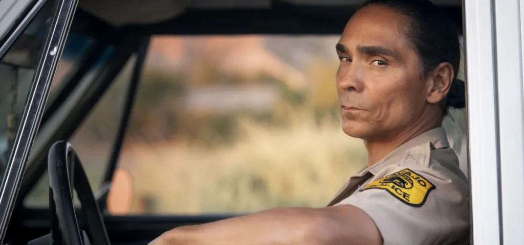 Leaphorn sits in his patrol car