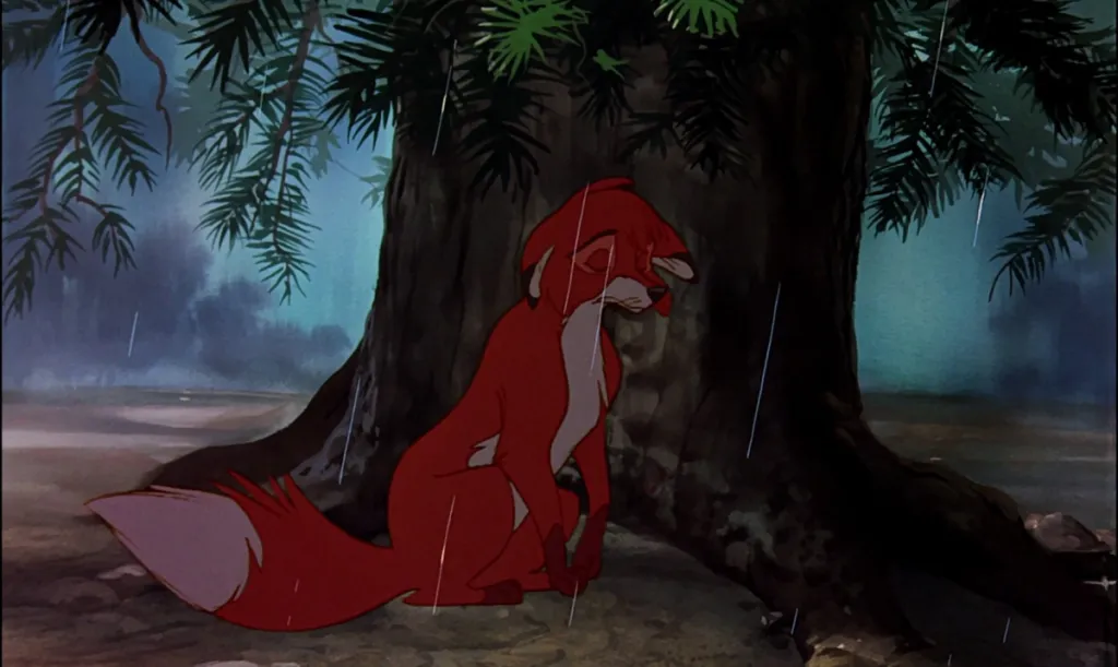 Tod takes cover in the rain in fox and the hound