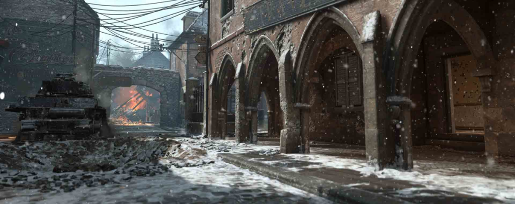 Carentan in Call Of Duty World War 2, displaying a ruined, war torn street, dusted with snow